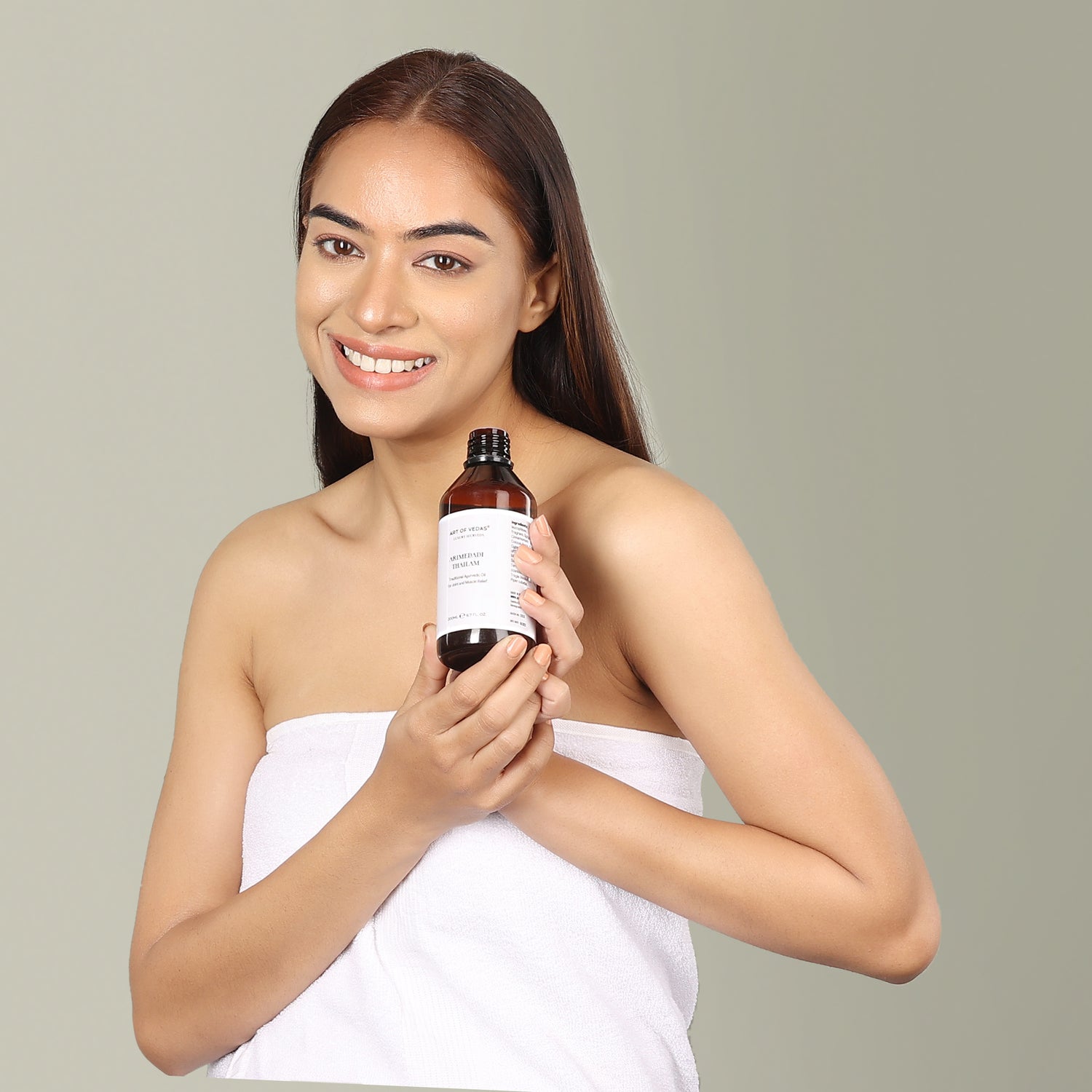 Art of Vedas Ayurvedic Skincare - Woman Holding Authentic Ayurvedic Oil Product for Natural Beauty and Wellness